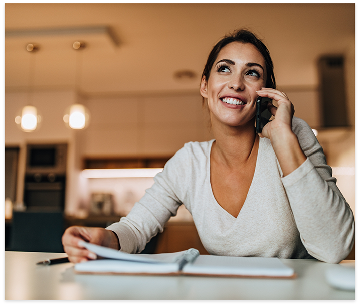 Smiling woman talking on phone