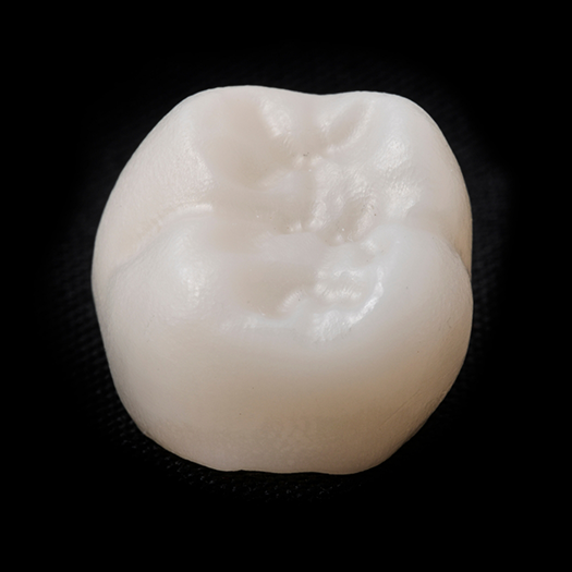 Dental crown on a black background