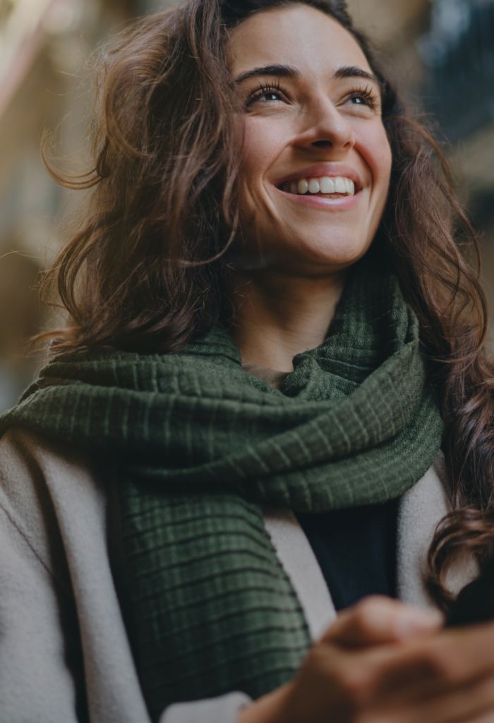 Smiling woman wearing a scarf