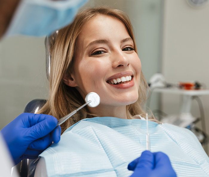 Female dental patient about to have teeth examined