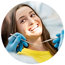 Female dental patient smiling at dentist