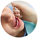 Patient having teeth examined by dentist