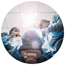 Dentists with masks performing oral surgery