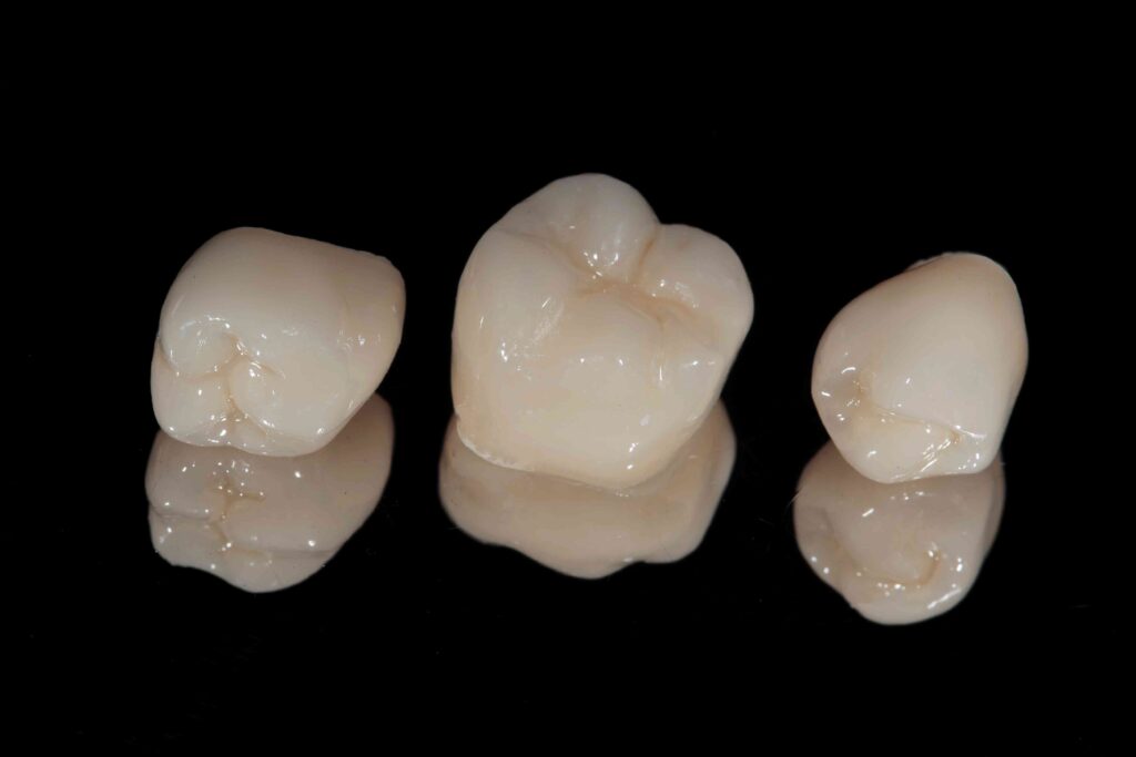 Dental crowns on a black background